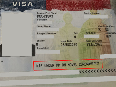 Image of a U.S. visa with National Interest Exception